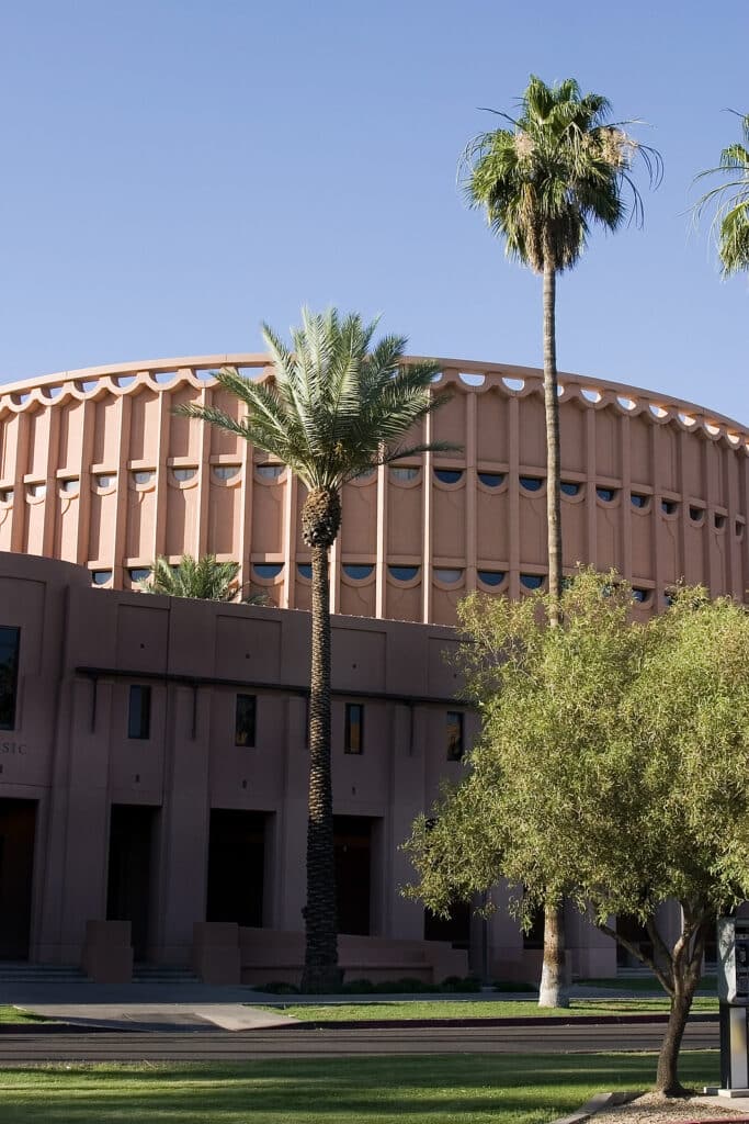 Vacation Travel Innovation Phoenix Arizona sports and entertainment scene with palms and a major venue in the city.